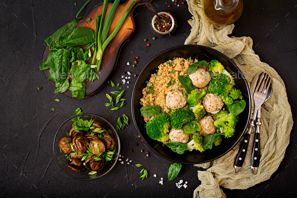 Baked meatballs of chicken fillet with garnish with quinoa and boiled broccoli. - Stock Photo - Images
