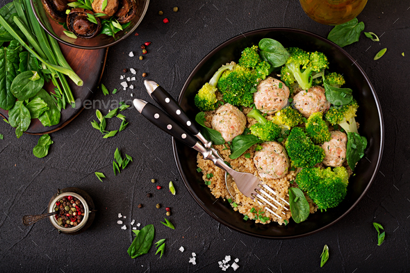 Baked meatballs of chicken fillet with garnish with quinoa and boiled broccoli. - Stock Photo - Images