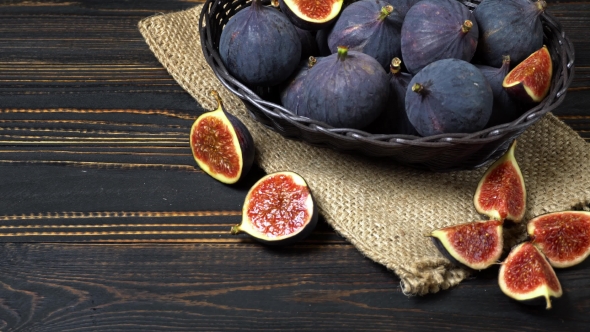 Fresh and Dried Fig Isolated on Wooden Background alt