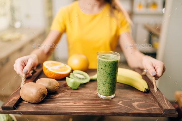 Female person with cocktail, fruits and vegetables - Stock Photo - Images