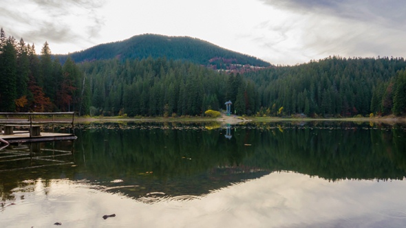 Autumn Sunset at Mountain Lake with Colorful Trees in the Forest alt