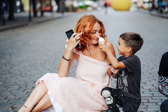 mom and son eat ice cream together Stock Photo by simbiothy | PhotoDune