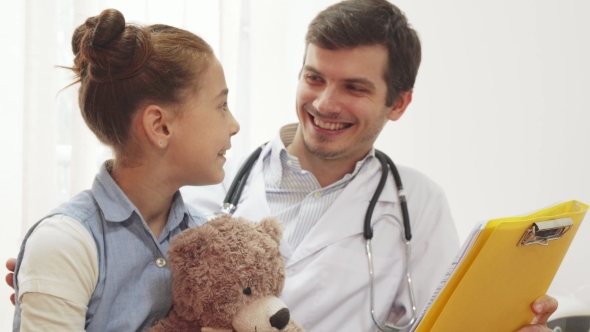 A Young Doctor and His Little Patient Carefully Read the Information alt