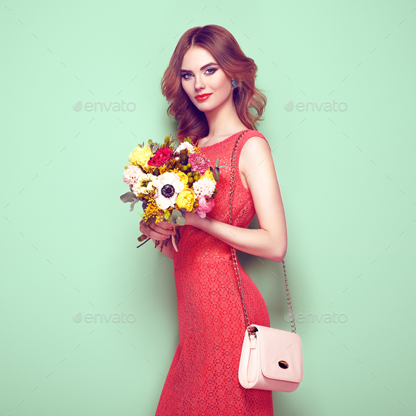 Blonde young woman in elegant red dress - Stock Photo - Images