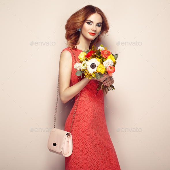 Blonde young woman in elegant red dress - Stock Photo - Images