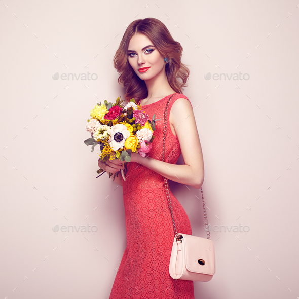 Blonde young woman in elegant red dress - Stock Photo - Images