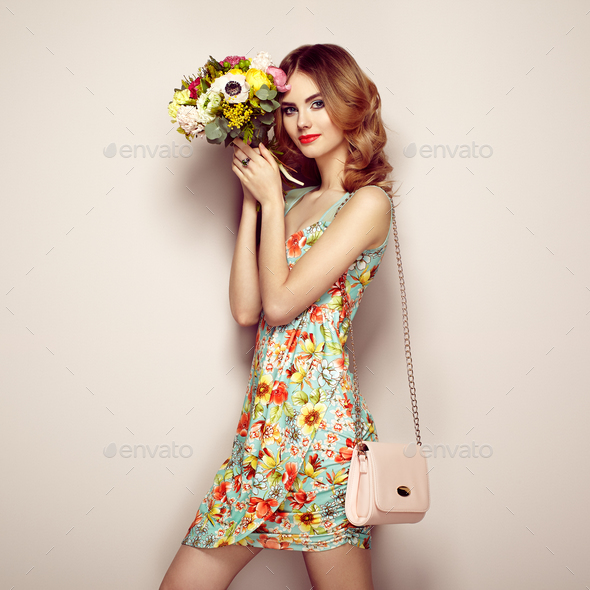 Blonde young woman in elegant floral dress - Stock Photo - Images
