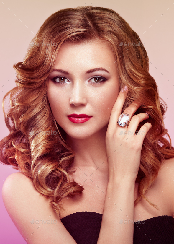 Blonde woman with long shiny wavy hair - Stock Photo - Images
