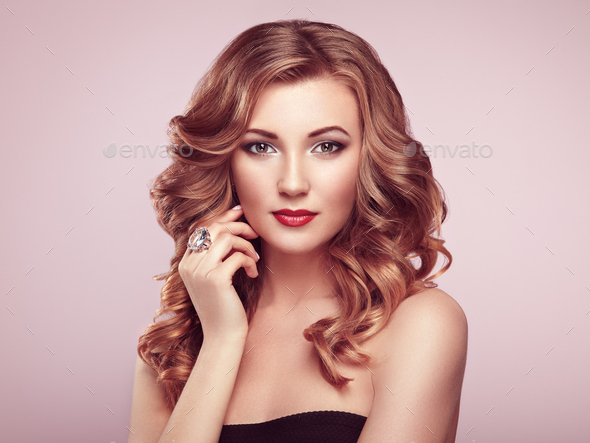 Blonde woman with long shiny wavy hair - Stock Photo - Images