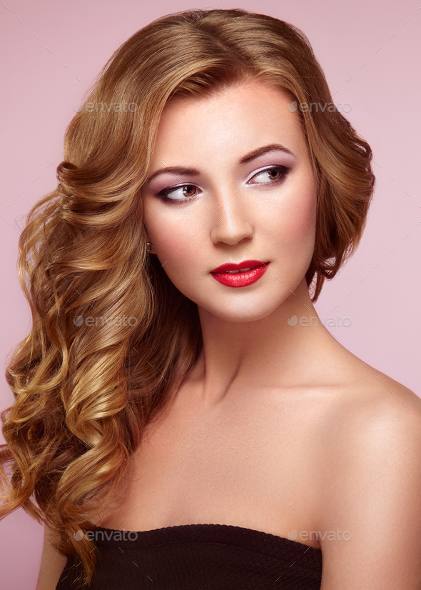 Blonde woman with long shiny wavy hair - Stock Photo - Images