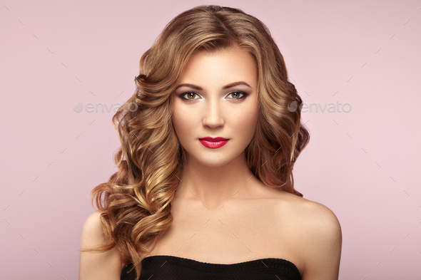 Blonde woman with long shiny wavy hair - Stock Photo - Images