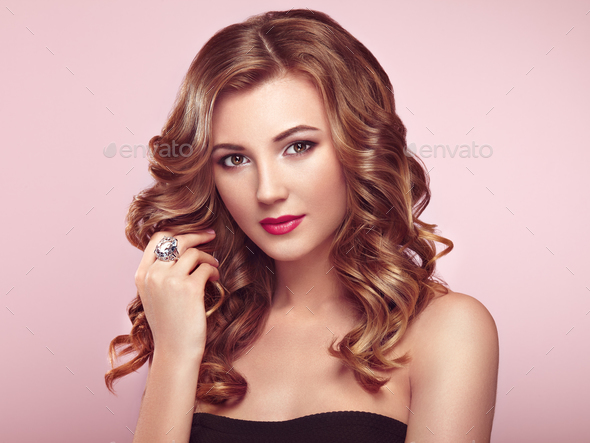Blonde woman with long shiny wavy hair - Stock Photo - Images