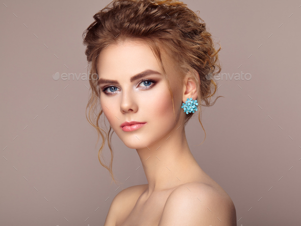 Fashion portrait of young beautiful woman with elegant hairstyle Stock Photo by heckmannoleg