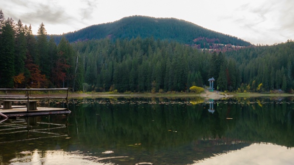 Autumn Sunset at Mountain Lake with Colorful Trees in the Forest alt