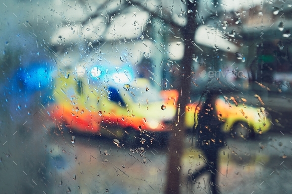 Emergency medical service in the rain - Stock Photo - Images