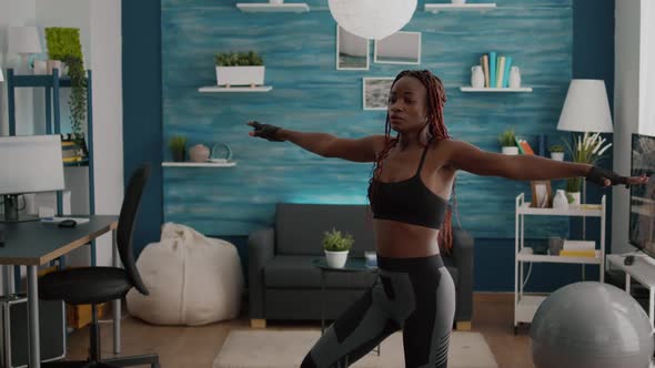 Athletic Woman with Black Skin Warming Up Before Aerobic Class alt