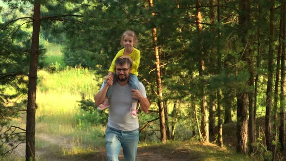 Father and Little Child in Summer Hike of Pine Forest