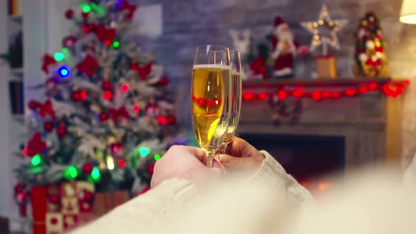 Close Up of Romantic Couple Clinking Champagne alt