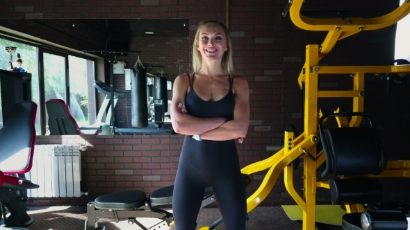 Fitness Woman Crossed Her Arms in the Gym