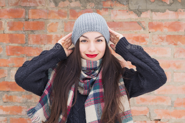Carefree girl, laughing on a winter day. Outdoor photo of young european woman cheating Stock Photo by ollinka
