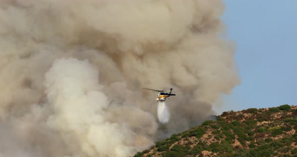 Warner Brothers Fire, Firefighter Helicopter Puts Out Burning Hollywood Hills alt