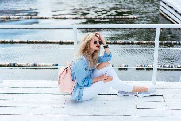 Blonde woman with a bag - Stock Photo - Images