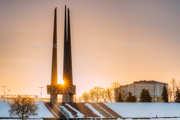 Vitebsk, Belarus. Sun Shines Through Main Monument Three Bayonet - Stock Photo - Images