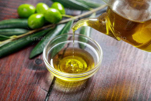 Olive oil and olive twig - Stock Photo - Images