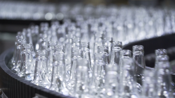 Bottles Moving Along the Conveyor Line alt