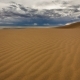 Clouds in the Desert Above the Sand Dunes - VideoHive Item for Sale
