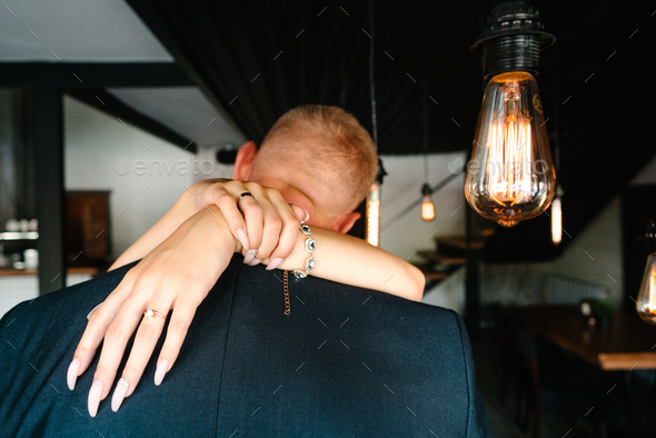 retro bulbs lights. newlyweds couple embracing - Stock Photo - Images