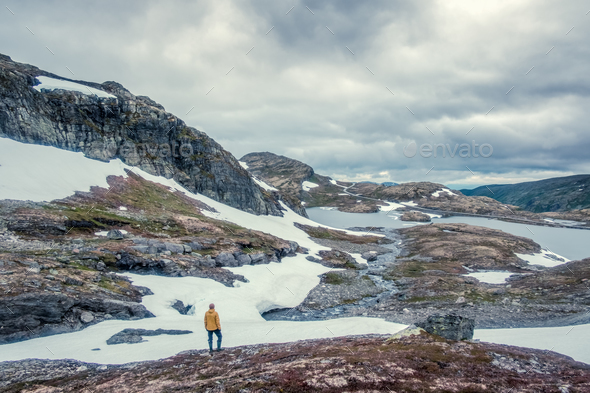 Typical norwegian landscape with snowy mountains - Stock Photo - Images