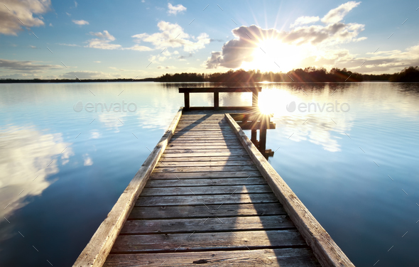 gold sunshine over wooden pier on big lake Stock Photo by catolla | PhotoDune