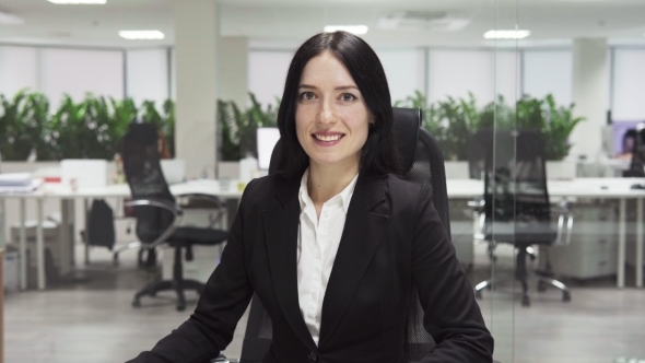 Adult Business Woman Smiling in Office