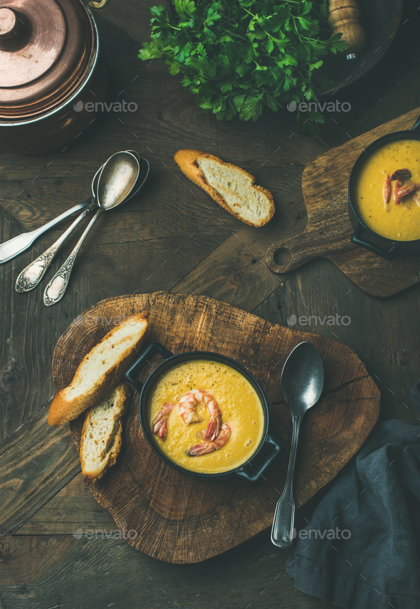 Flat-lay of corn creamy soup with shrimps, top view - Stock Photo - Images