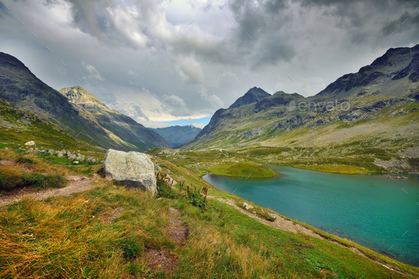 Beautiful view of the emerald alpine lake. Dramatic and pictures - Stock Photo - Images