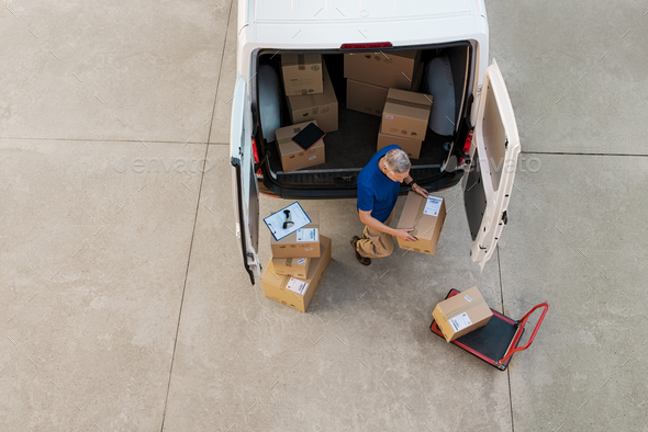 Courier delivering parcel Stock Photo by Rido81 | PhotoDune