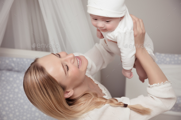Happy mother with her baby - Stock Photo - Images