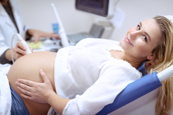 Pregnant female on the ultrasound scan - Stock Photo - Images
