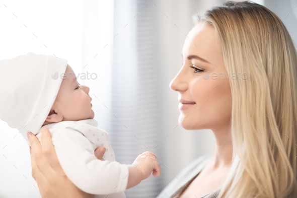 Beautiful mother with a little baby - Stock Photo - Images