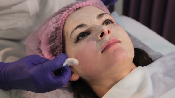 A Gloved Hand Removes the Mask From the Woman's Face Reddened Irritated Skin After Mesotherapy