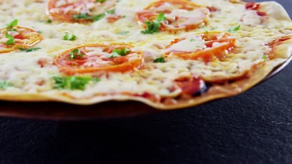 Baked pizza with cherry tomato toppings alt