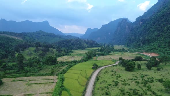 Landscape around the city of Vang Vieng in Laos seen from the sky alt