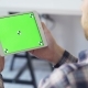 Businessman Holds in Hands and Uses Device With Touch Green Screen - VideoHive Item for Sale
