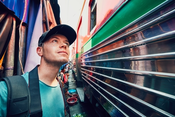 Tourist on the railway market - Stock Photo - Images