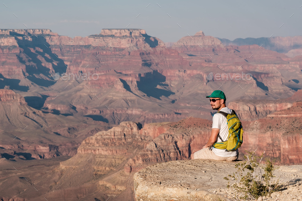 Tourist with backpack at Grand Canyon Stock Photo by haveseen | PhotoDune