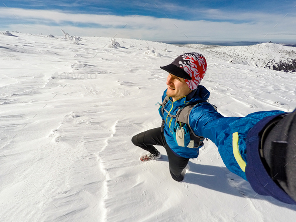 Trail runner selfie in winter mountains - Stock Photo - Images