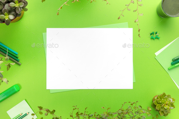 Environmental concept of a green office desk with supplies - Stock Photo - Images