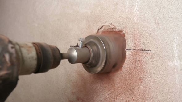 Diamond Drilling Machine Hole in the a Brick Wall in a New Apartment.