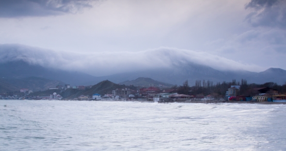 White Clouds Float Over the Sea and Hills